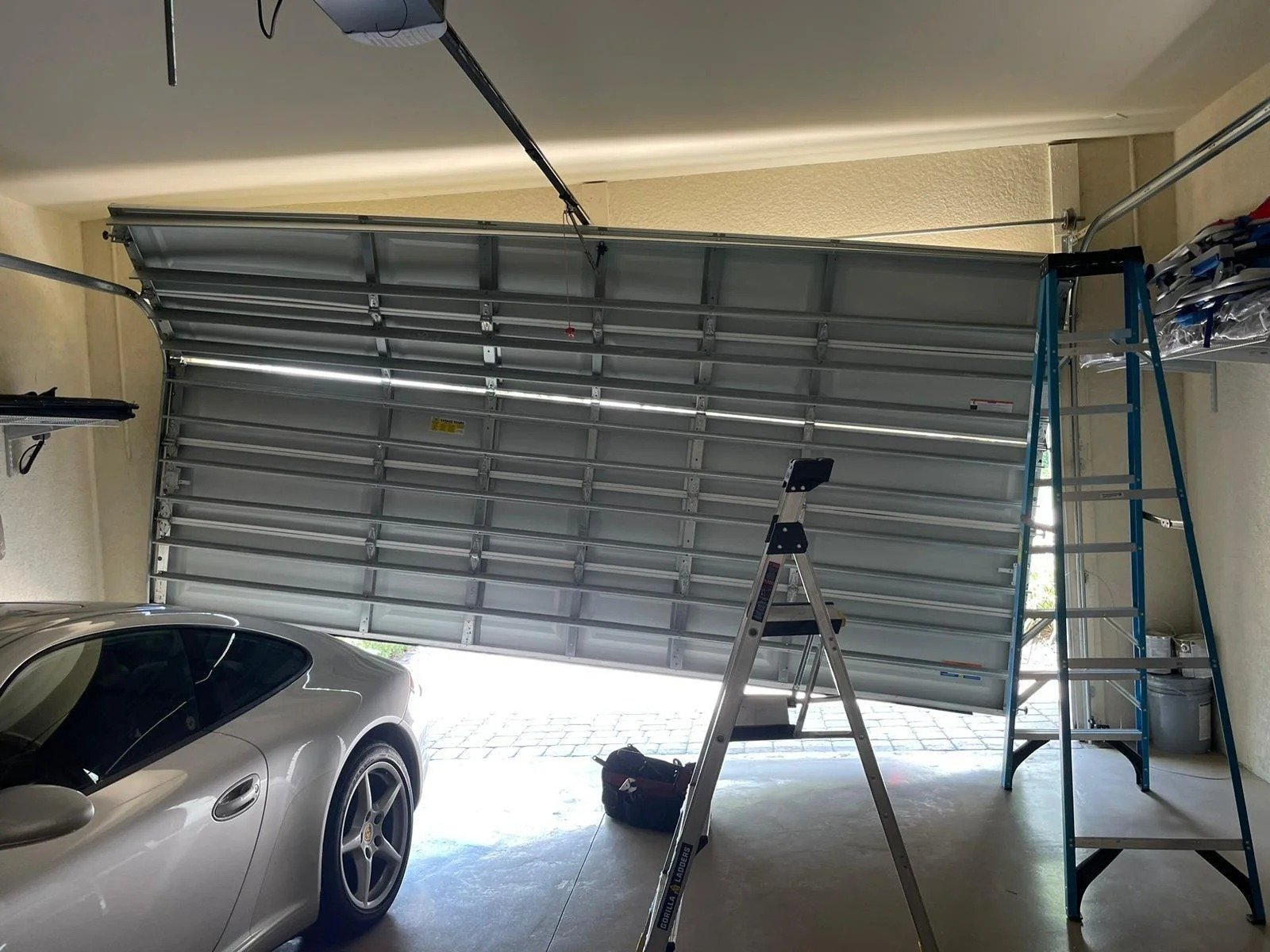 Off-track garage door repair — Atlas realigns and restores garage doors in Alpharetta